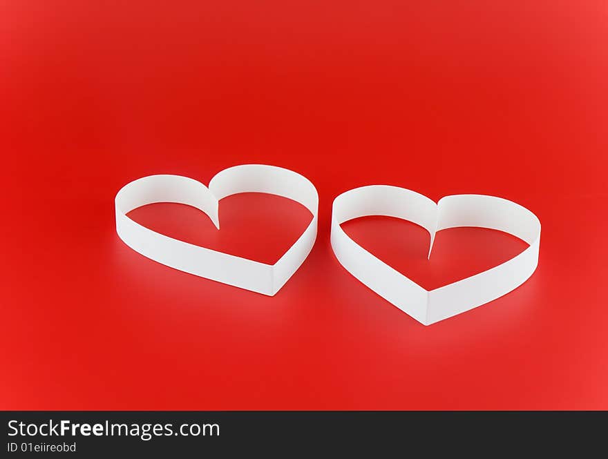 Two White Hearts,on Red Background.