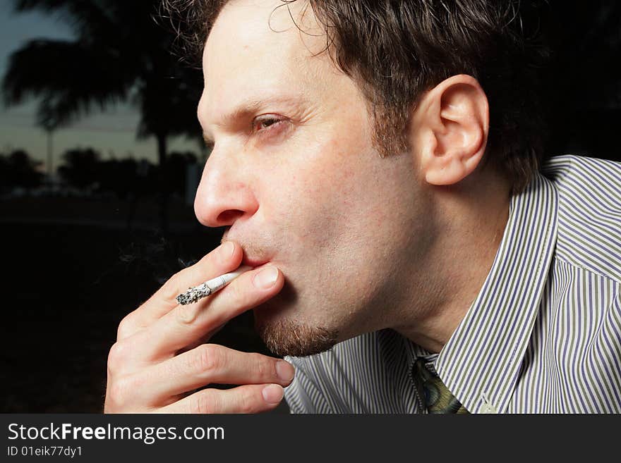 Man Smoking A Cigarette