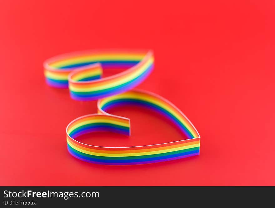 Two hearts, paint of a six-colour gay flag.Focus on front part first heart. Two hearts, paint of a six-colour gay flag.Focus on front part first heart.