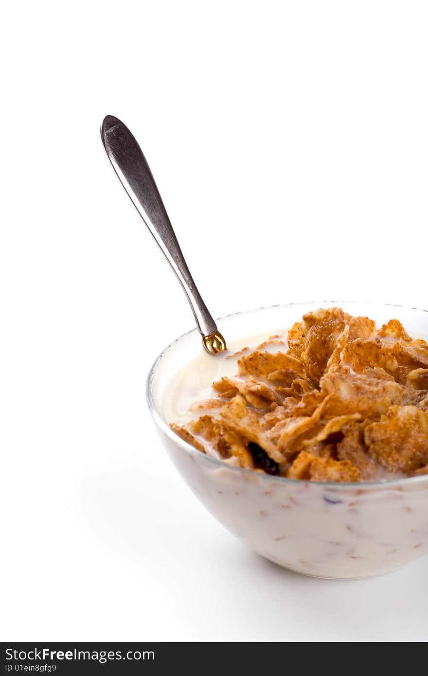 Cornflakes with milk isolated on white