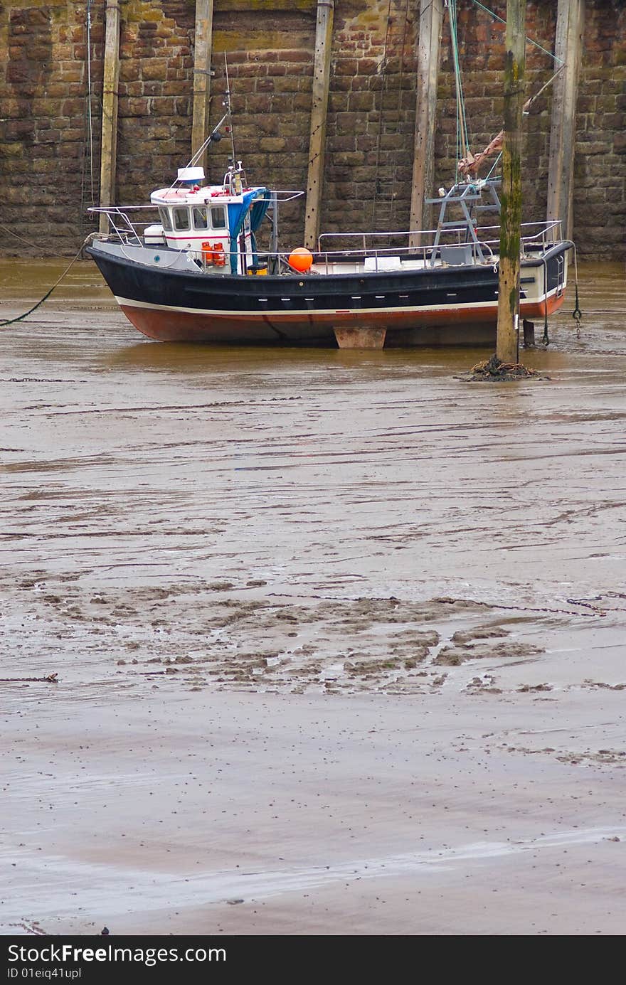 Fishing boat moored in harbor