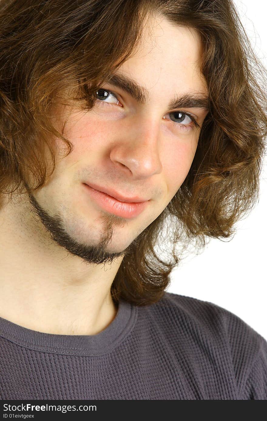 A portrait of an attractive young man against a white background.