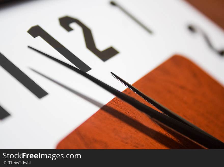 Vertical color image of a modern wall clock close-up. Vertical color image of a modern wall clock close-up