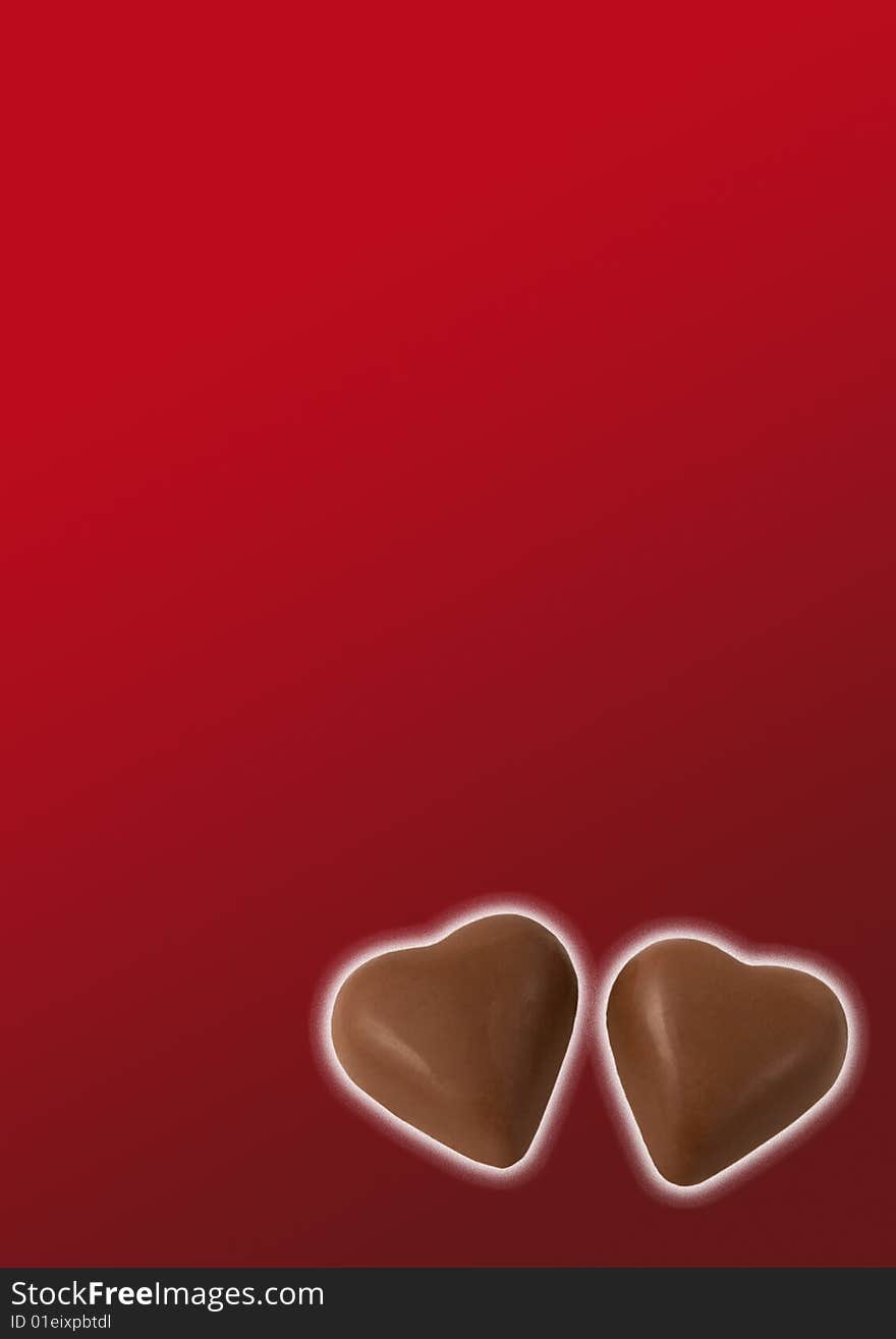 Two chocolate hearts on red background