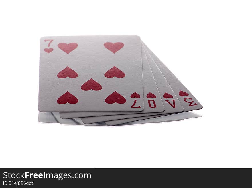 4 heart playing cards isolated on white spelling the word love. 4 heart playing cards isolated on white spelling the word love