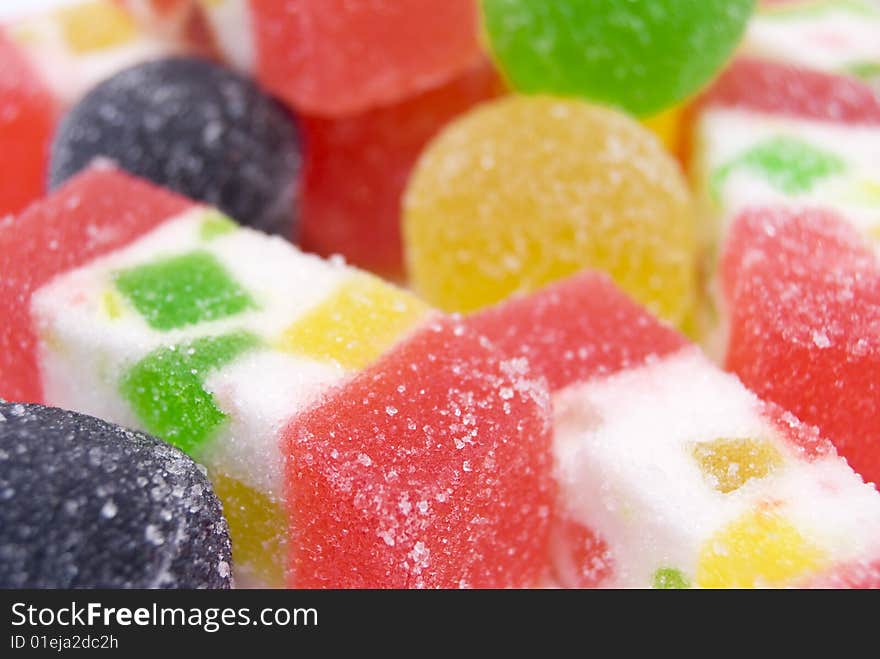 Sweet fruit color candy on white background