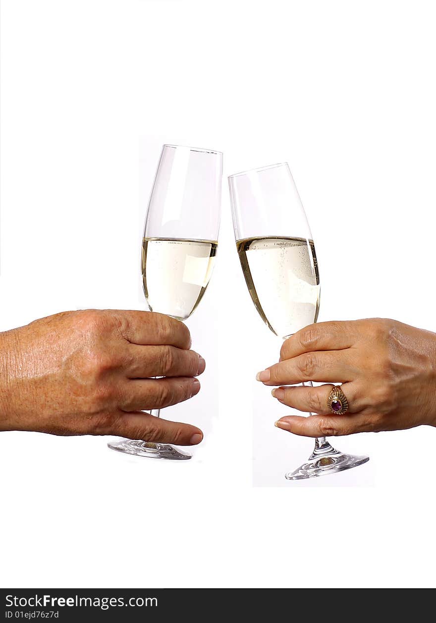 A male and Female celebrating with a glass of champagne. A male and Female celebrating with a glass of champagne