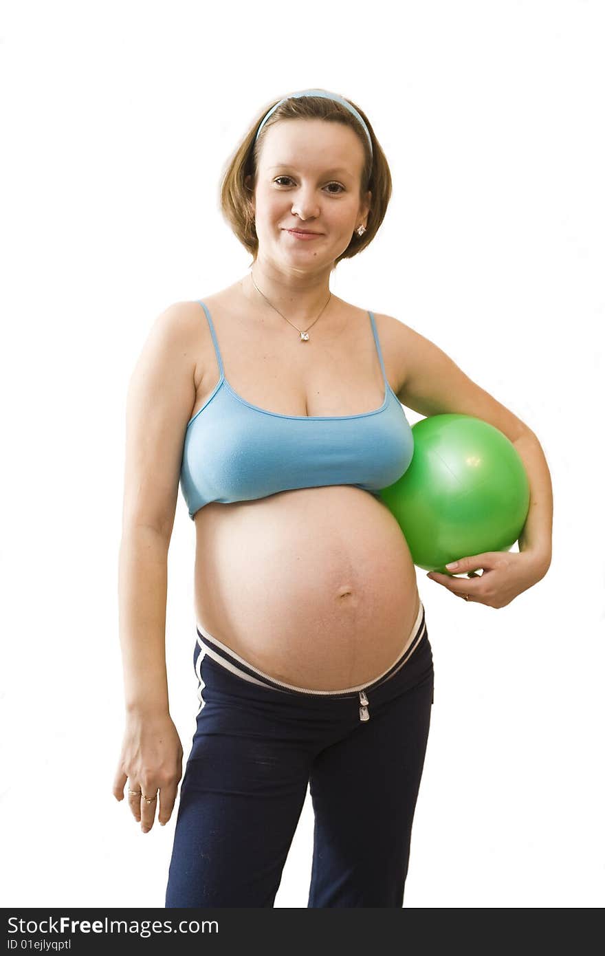 Young pregnant woman with green ball