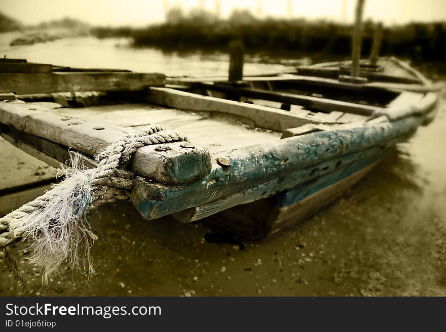 Old fishing boat docked at the shore. Old fishing boat docked at the shore