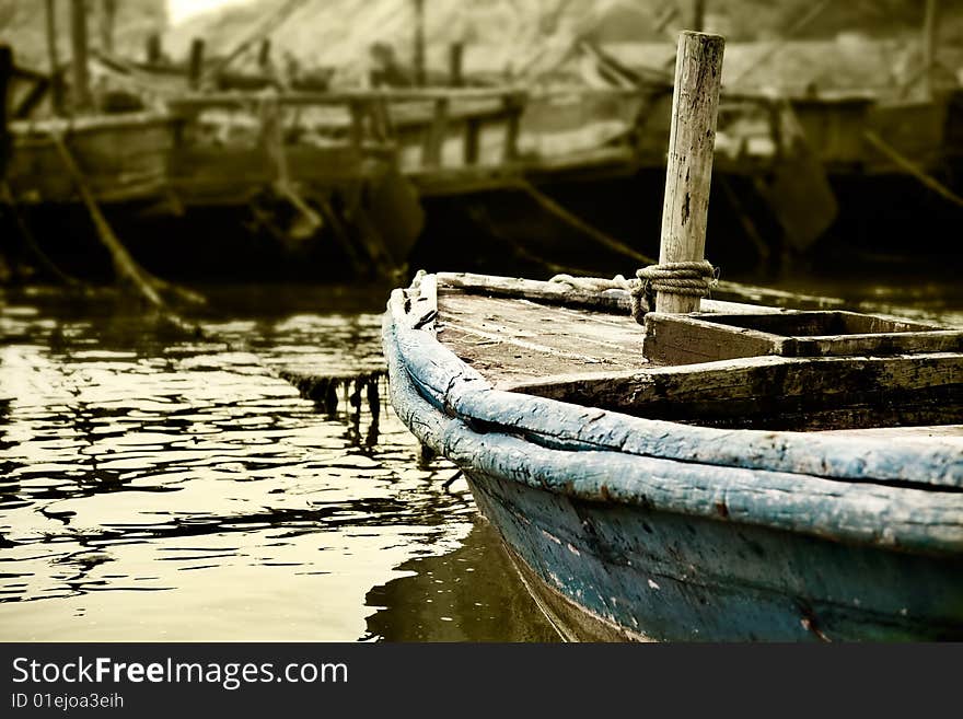 Old fishing boat docked at the shore. Old fishing boat docked at the shore