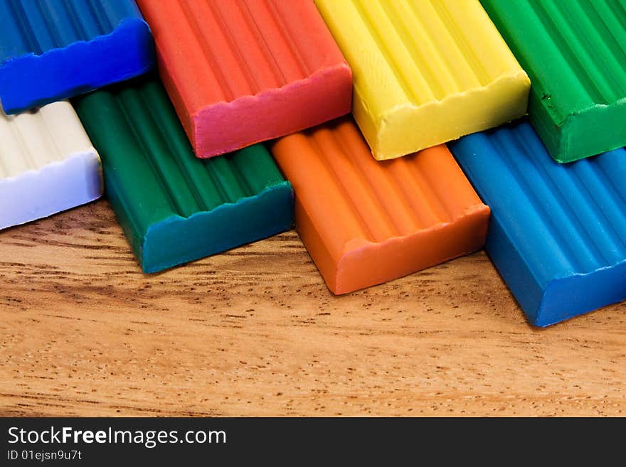 Plasticine on a wooden background