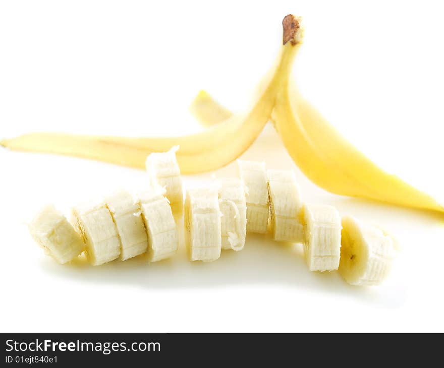 Yellow banana slices isolated on white background