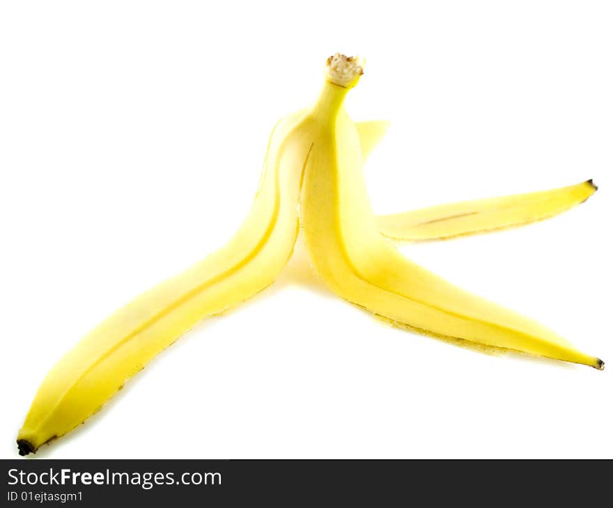 Yellow banana peel isolated on white background