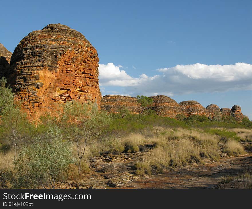 Cloudscape over shrubby vegetation and famous rock formations in Bungle Bungle national park, Western Australia. Australia