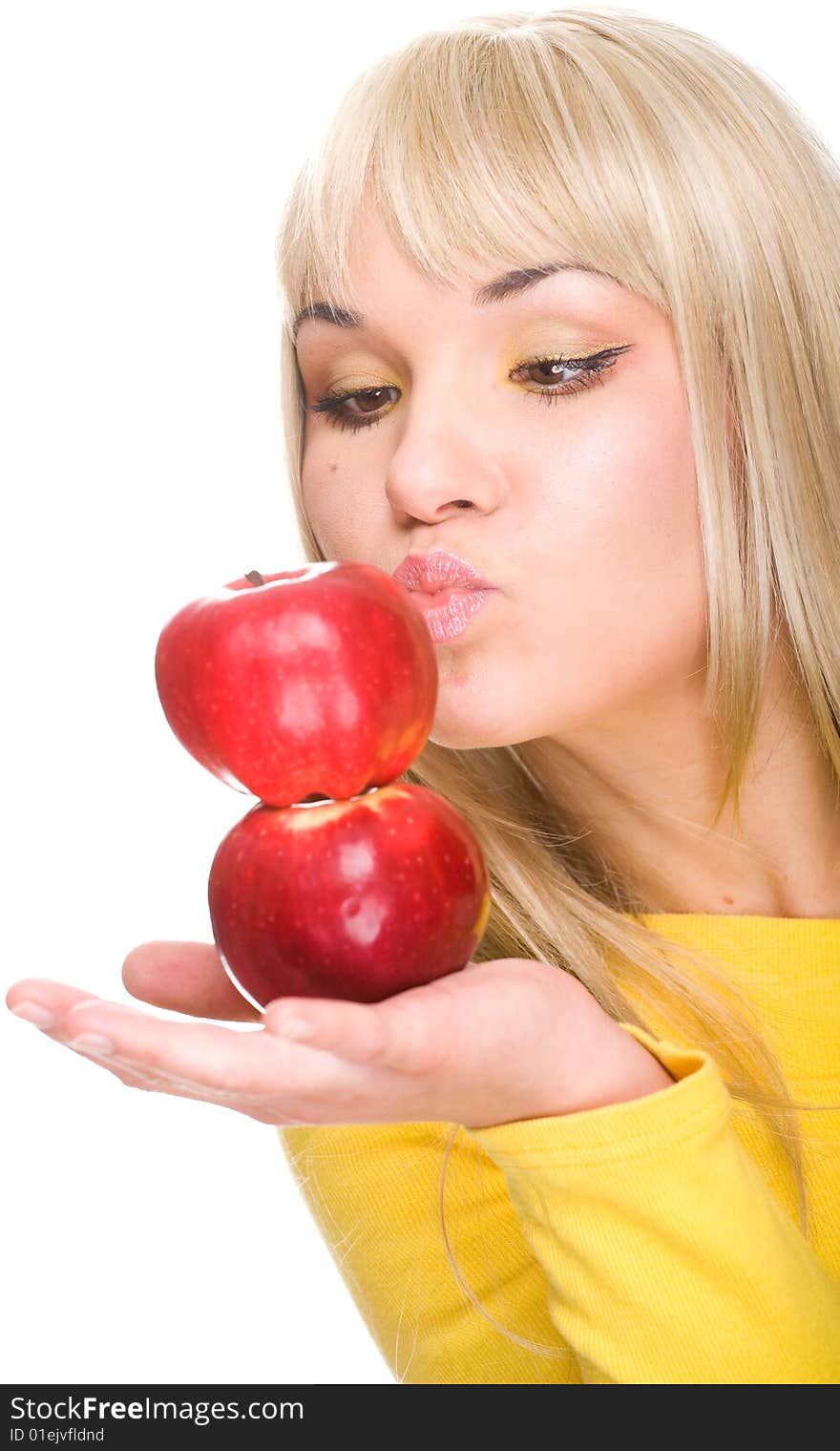 Attractive woman with apple. over white background. Attractive woman with apple. over white background