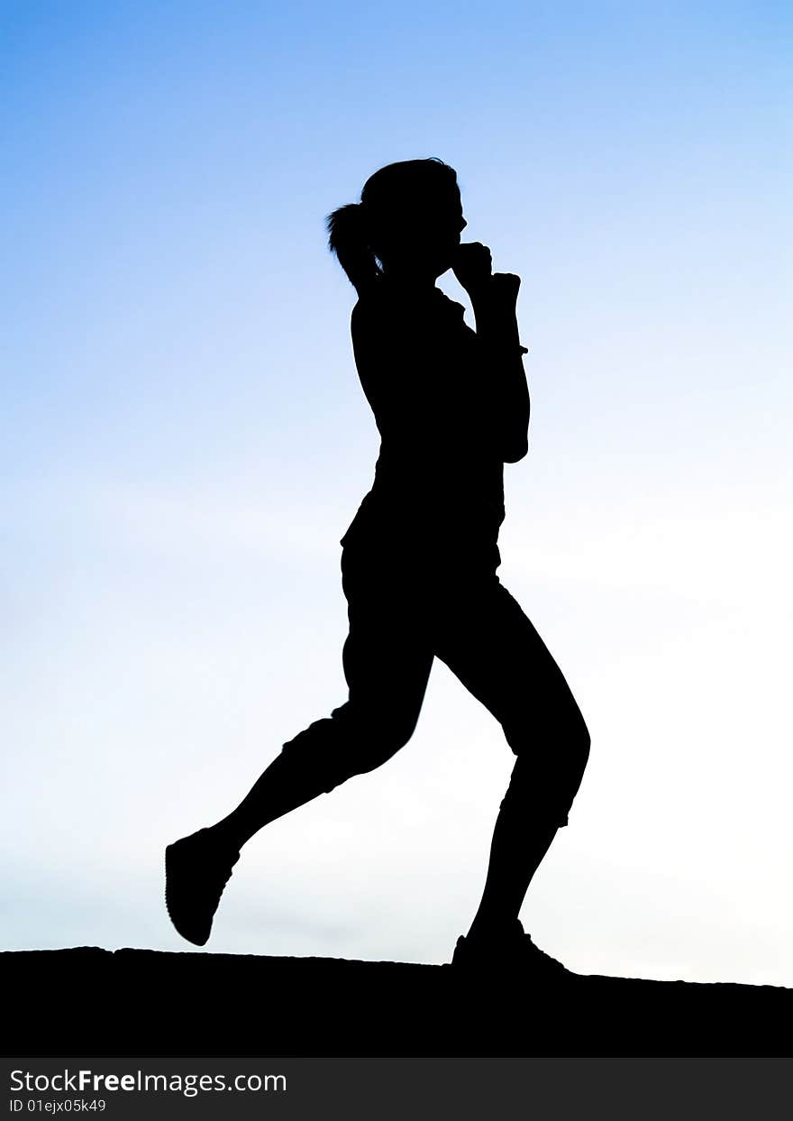 Silhouette of young sport woman or girl