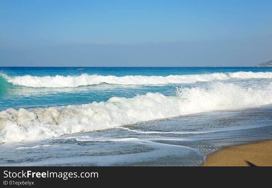 Waves and sandy beach.