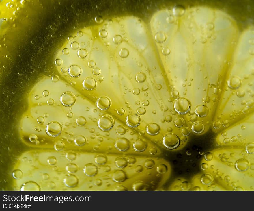 Photo of lemon slice fruit and bubbles