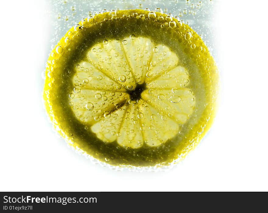 Photo of lemon slice fruit and bubbles