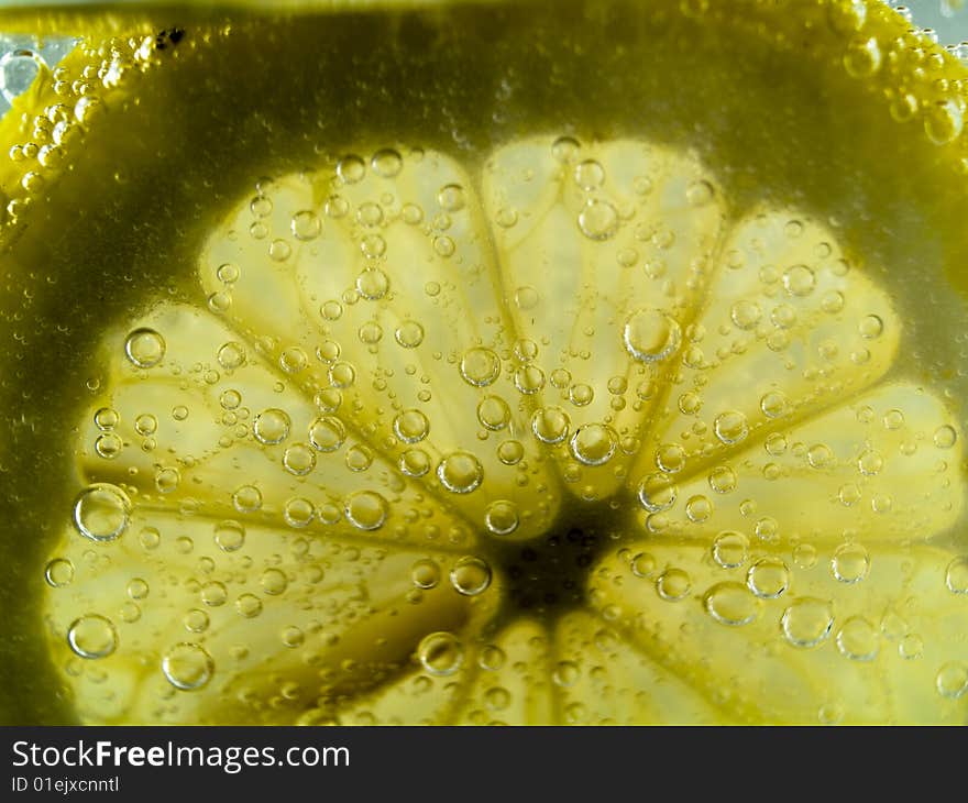 Photo of lemon slice fruit and bubbles