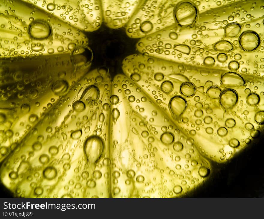 Photo of lemon slice fruit and bubbles