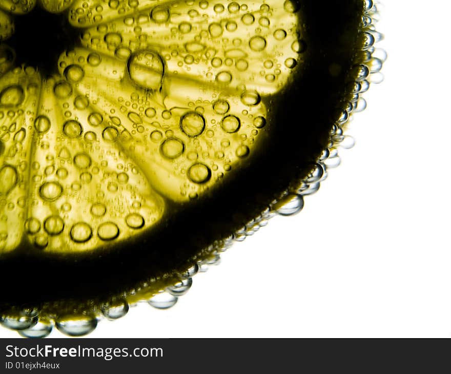 Photo of lemon slice fruit and bubbles