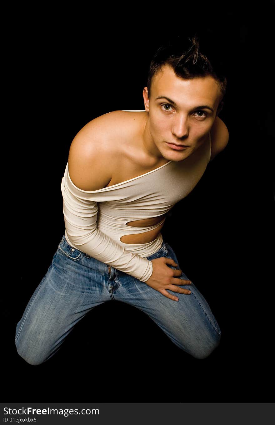 Young Sensual Man On A Black Background