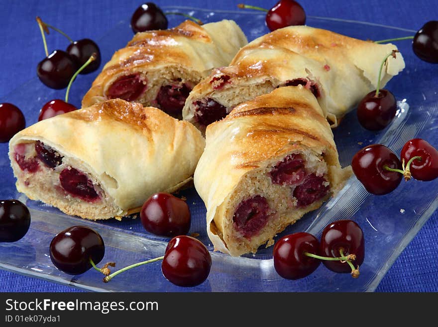 Rolled pastry with cherries