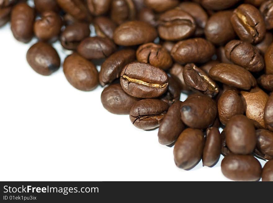 Close up of coffee beans isolated on white background