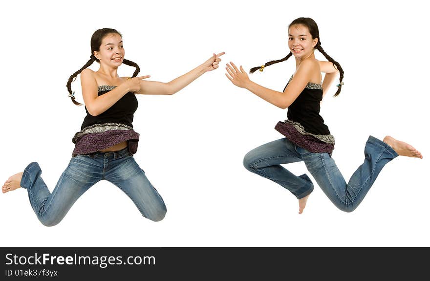 Two identical girls  jumps on a white background