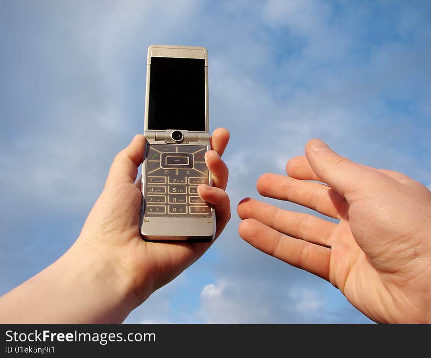 Hand holding a mobile phone for support