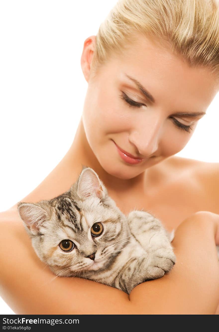 Beautiful young woman with adorable kitten (focus on kitten)