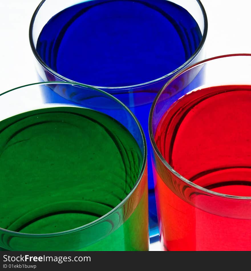 Glass with drink red, blue and green color. Glass with drink red, blue and green color