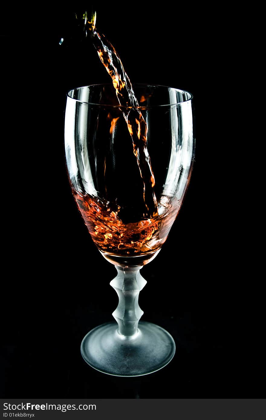 Glass of wine on a black background