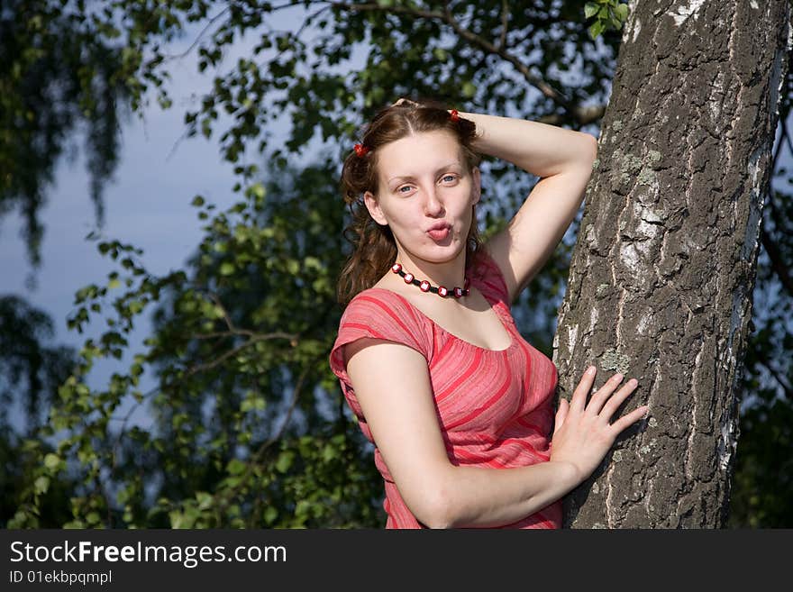 Outdoor portrait of 20-25 years woman near tree, birch