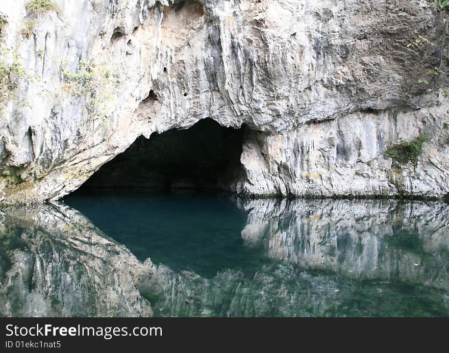 A lake with mountains with green water