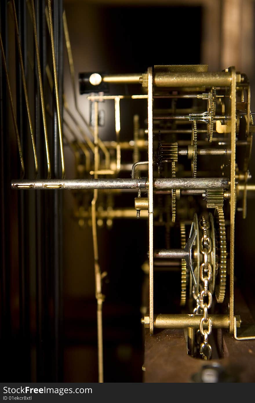 Inner workings of an old fashioned grandfather clock. Inner workings of an old fashioned grandfather clock