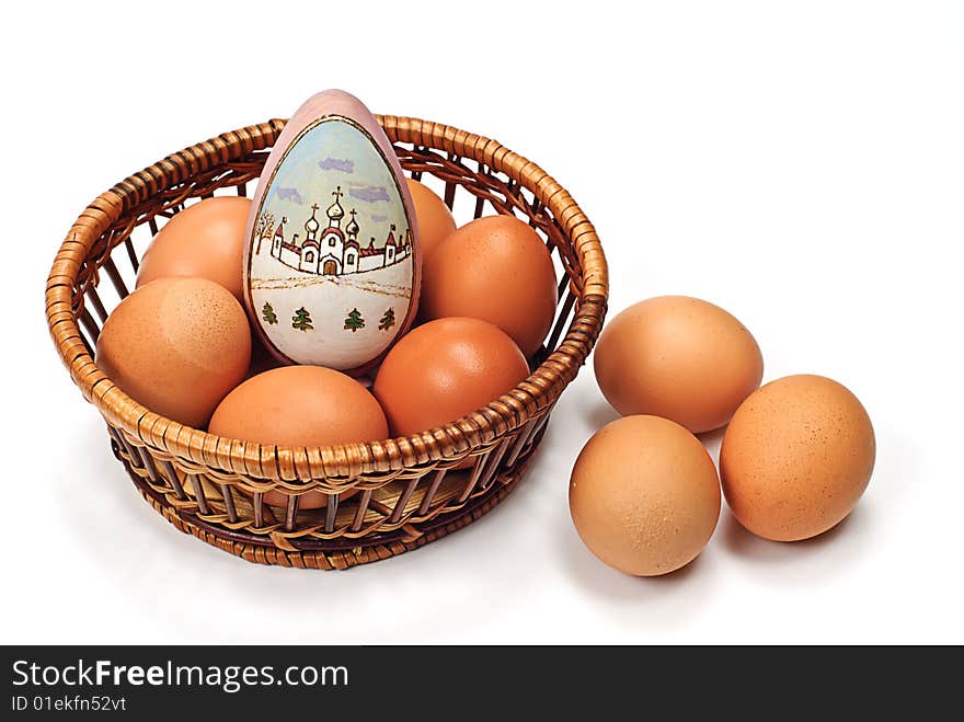 Easter egg in wooden basket on white. Easter egg in wooden basket on white