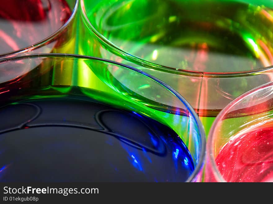 Glass with drink red, blue and green color. Glass with drink red, blue and green color