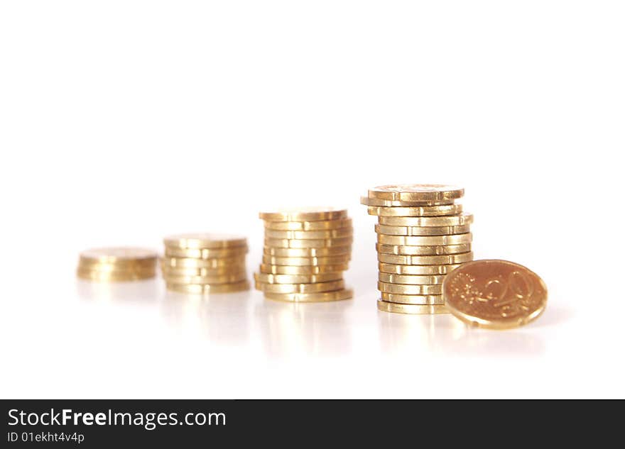 Stacked up coins. Coins are mirrored. Isolated over white. Ideal Businesshot. Stacked up coins. Coins are mirrored. Isolated over white. Ideal Businesshot.