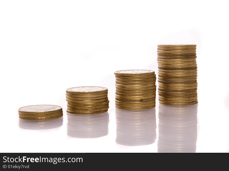 Columns of golden coins isolated on white. Columns of golden coins isolated on white.