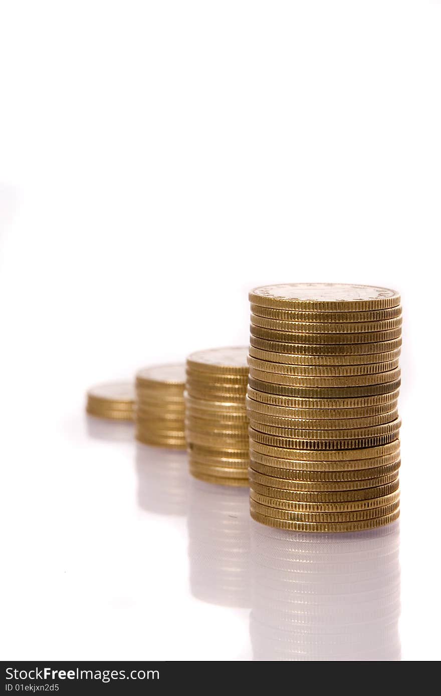 Columns of golden coins isolated on white. Columns of golden coins isolated on white.