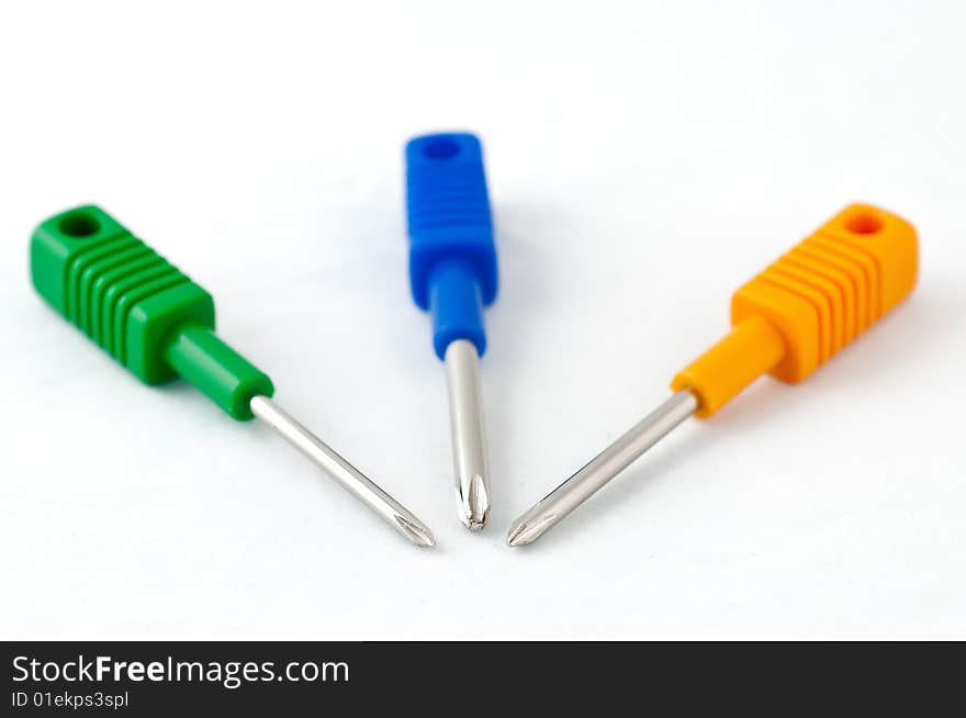 Colorful screwdrivers on white background