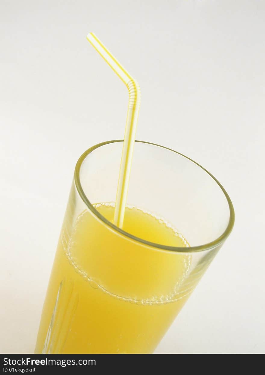 Glass of orange juice isolated over a white background.