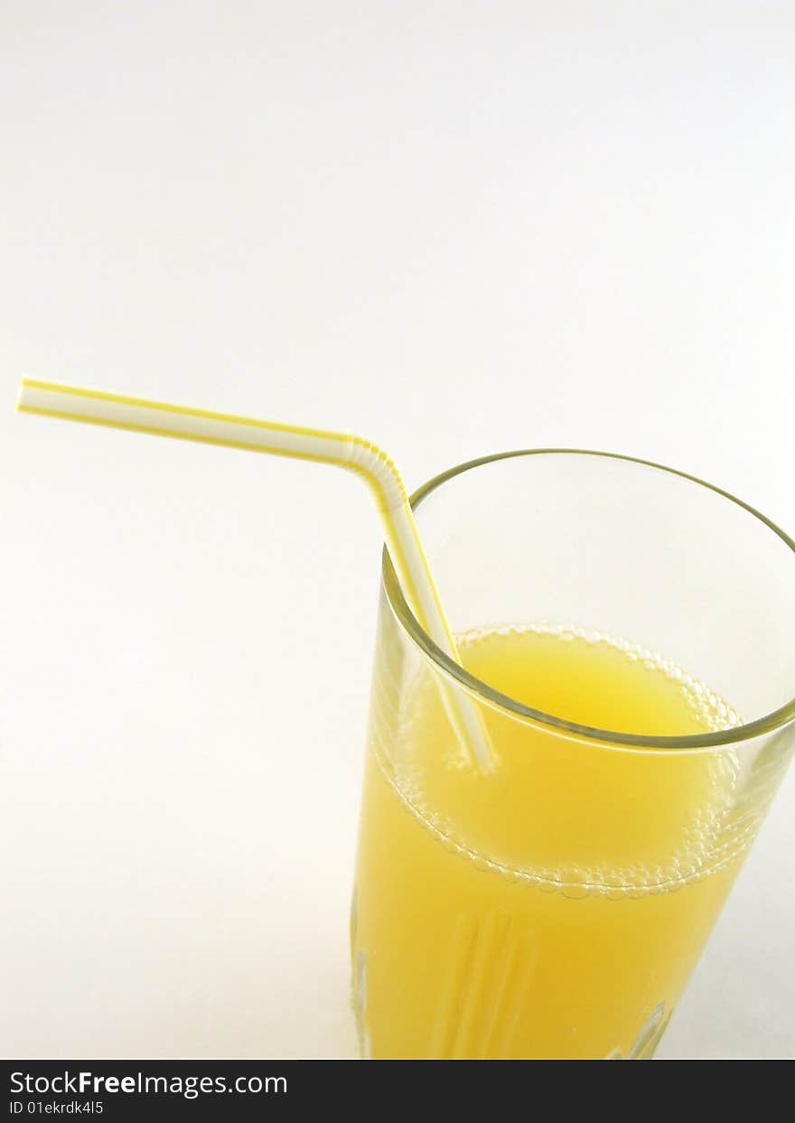 Glass of orange juice isolated over a white background.