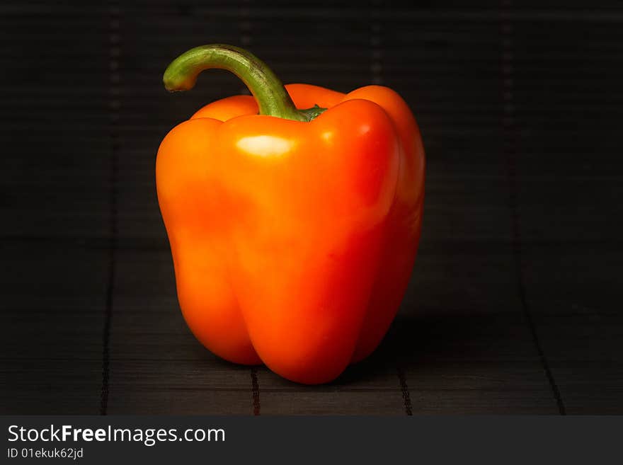 Red pepper on black background