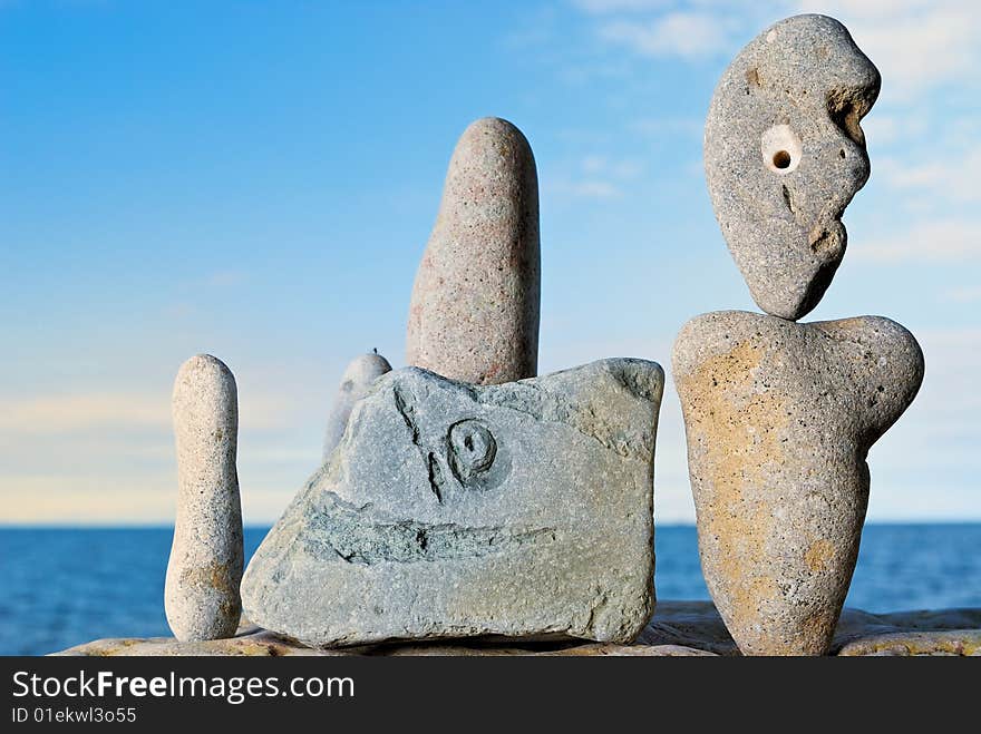 Freakish stones in morning light on the bank of northern sea. Freakish stones in morning light on the bank of northern sea