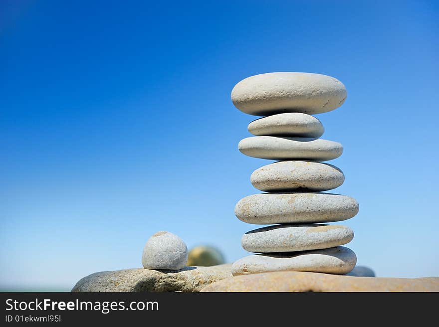 Seven sea stones on a beach in the summer morning. Seven sea stones on a beach in the summer morning