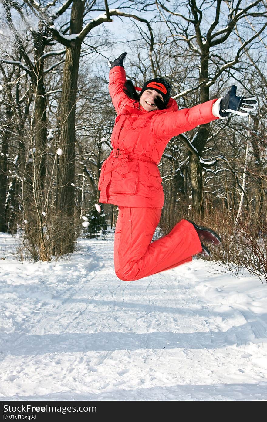 A young woman in the winter jump