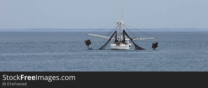 Shrimp boat dragging net